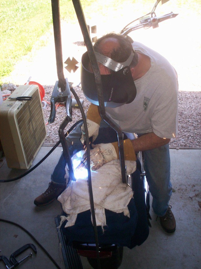 Welding the sissy bar onto the side plates